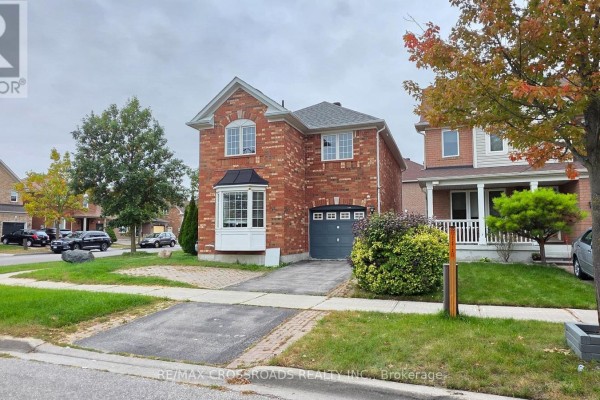 Street view of a residential neighborhood with multi-story brick houses. - Bsmt - 23 Wharnsby Drive, Toronto