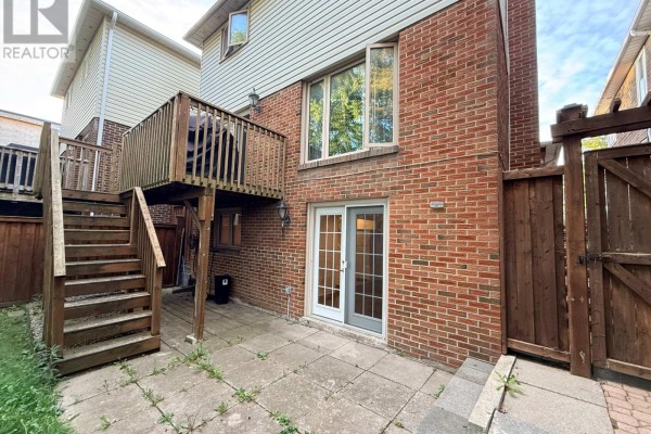 Basement recreation room with a rowing machine, treadmill, and white refrigerator. - Bsmt - 39 Aberfeldy Crescent, Markham