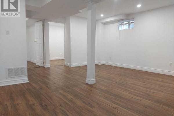 Spacious basement living area with laminate flooring and recessed lighting - Bsmt - 40 Gray Crescent, Richmond Hill