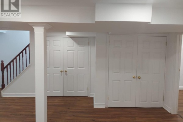 Basement hallway featuring double closets and access to stairs - Bsmt - 40 Gray Crescent, Richmond Hill