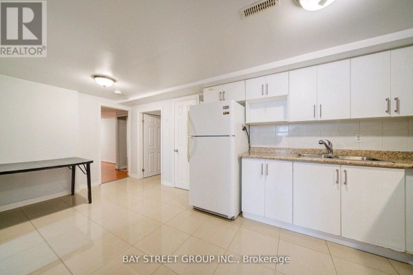 Entrance area with tiled floor and closet, leading to other rooms - Bsmt - 5 Lockdare Street, Toronto