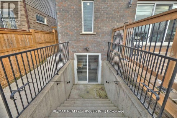 Basement living area with a mattress on a frame and a desk. - Bsmt - 6045 Ernest Crescent, Niagara Falls