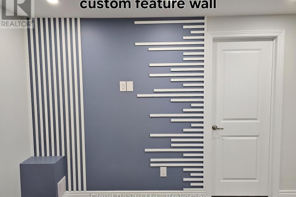 Interior wall with a grey base and a decorative white slat and striped accent design. - Bsmt - 95 Northglen Boulevard, Clarington