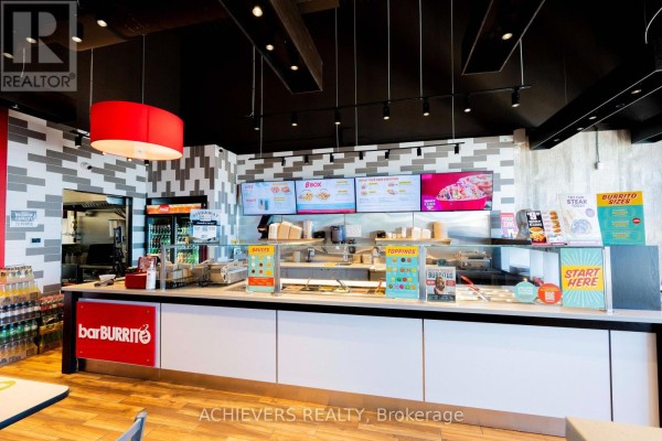 Service counter with food displays, digital menus, and order terminals inside BarBURRITO. - Building C, Unit #4a - 130 Atherley Rd Road, Orillia