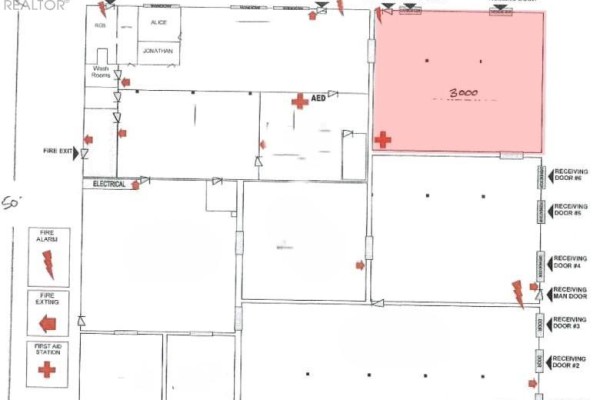 Floor plan shows a commercial space with multiple rooms, receiving doors, and safety equipment symbols. - C - 201 Bay Street, Midland