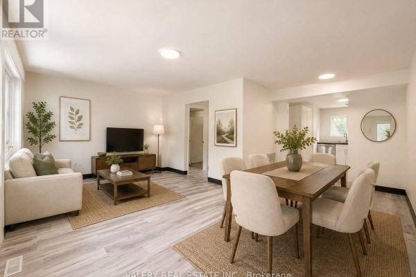 Living and dining area with light wood laminate flooring, a sofa, coffee table, and dining table. - C - 532 Sunnydale Place, Waterloo