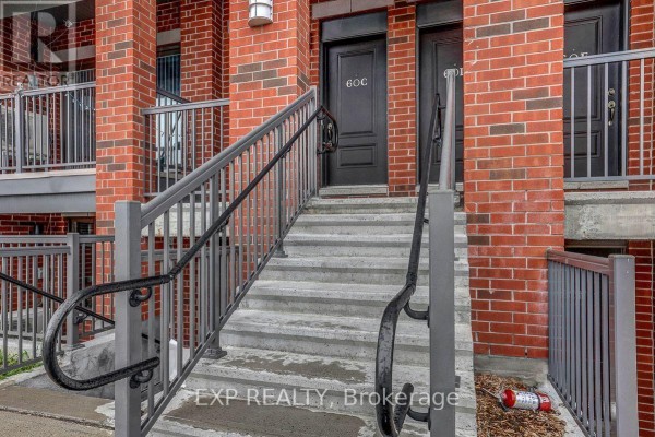 Staircase leading to upper levels with carpeted steps and handrail - C - 60 Jaguar Private, Ottawa