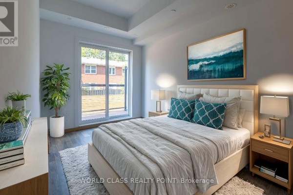 Bedroom with a king-size bed, bedside tables, and a balcony door. - C3-201 - 3425 Sheppard Avenue E, Toronto