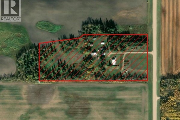 Aerial view of a large acreage property with multiple buildings, trees, and fields. - Choiceland Acreage, Torch River Rm No  488