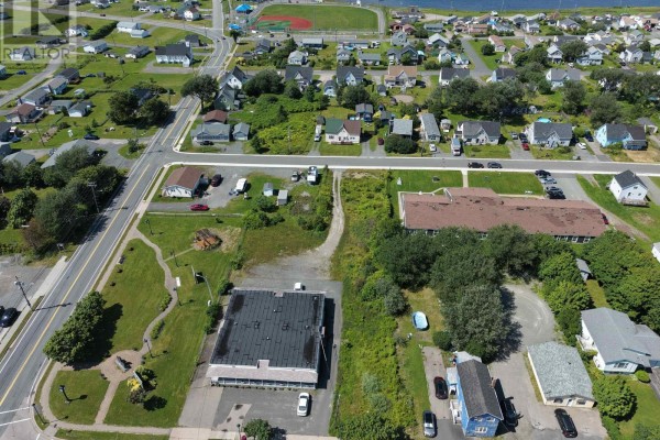 Aerial view of the property with outlined boundaries and surrounding structures. - Commercial St Dominion Land, Dominion