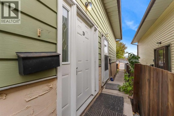 Staircase leading to upper level with light-colored flooring - D, 903 44 Street Se, Calgary