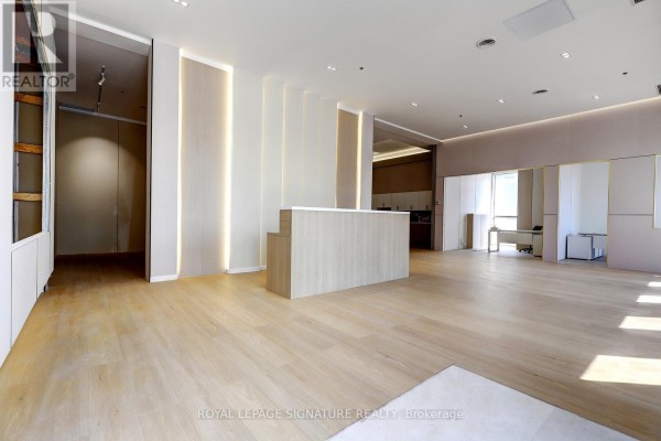 Room with light wood flooring and a large, covered object on the floor. - D - 310 Steelcase Road E, Markham