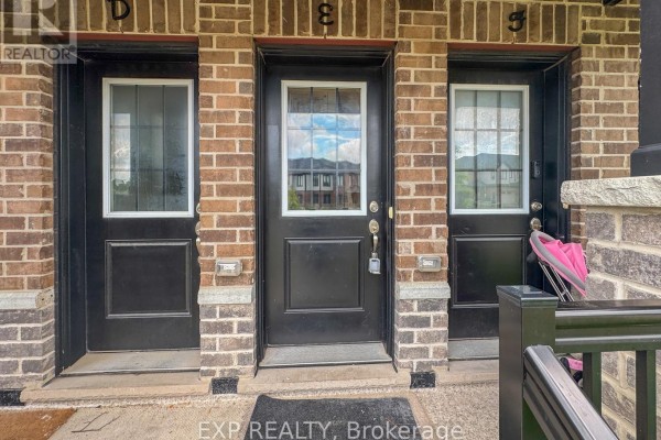 View of townhouse entrances 'D', 'E', and 'S' with black doors and brick detailing. - E - 150 Rochefort Street, Kitchener