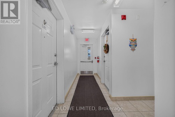 Entryway with tile flooring, staircase, and door to the outside - E-202 - 59 Arch Brown Court, Barrie