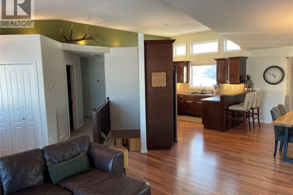A view from the living room into the kitchen and dining area. - Etomami River Acreage 15 Acres, Hudson Bay Rm No  394