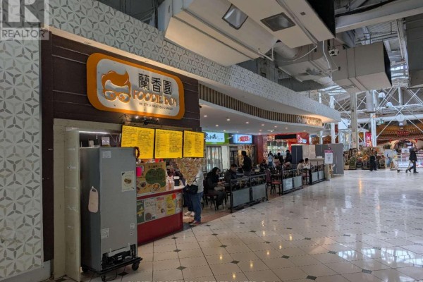 Another view of the food court with seating areas and colorful menu boards - F28 - 4300 Steeles Avenue E, Markham