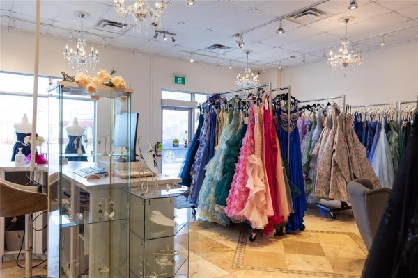 Interior view highlighting dress racks, display case, and checkout area. - G&h 197 Main Street, Steinbach