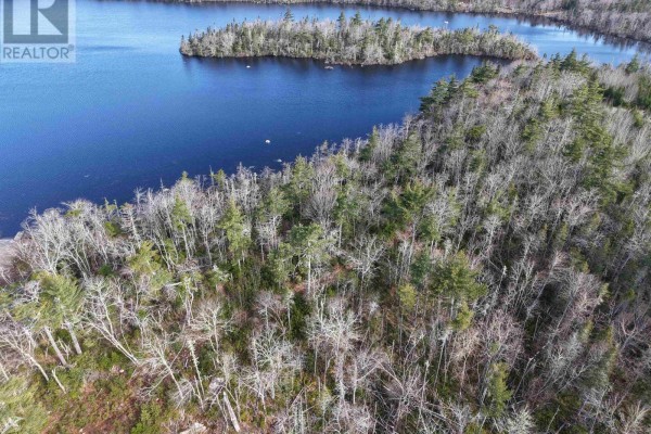 Aerial view of a dark lake with small islands covered in trees and dense forest. - Granite Ridge Road, Birchtown