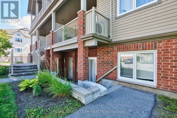 Covered concrete patio area with brick pillars and tiered stone landscaping. - H - 105 Fraser Fields Way, Ottawa