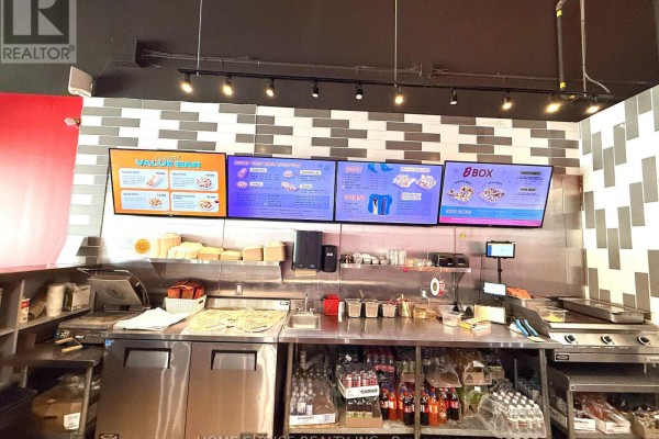 Service counter with menu displays, food preparation area, and beverage storage - H5 - 367 Cundles Road E, Barrie