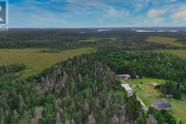 Aerial view of Gabarus Highway with property lines, showing proximity to Harbour Cove and forested terrain. - Highway 327, Gabarus