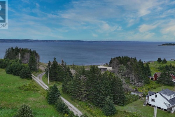 Aerial view of wooded landscape with text overlay reading 'Aerial photos coming soon'. - Highway 327, Gabarus