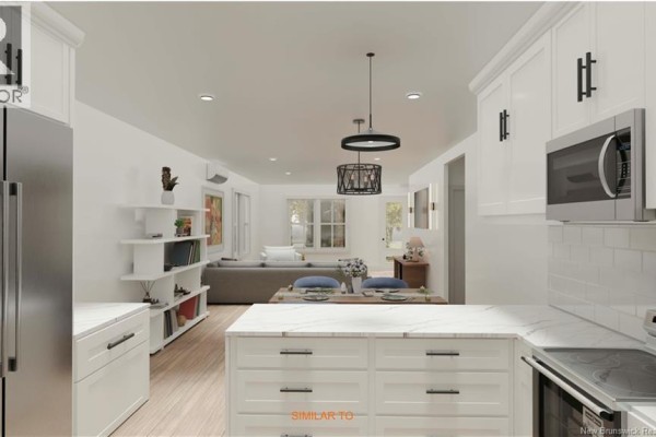 View from kitchen island to dining area and living room, white cabinetry, dark hardware. - Homestead Drive, Hampton