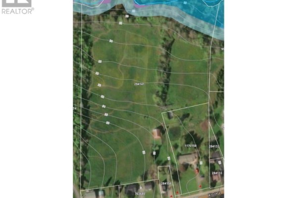 Drone view of a snowy field with red property lines bordering a wooded area and village. - Hunter River, Hunter River