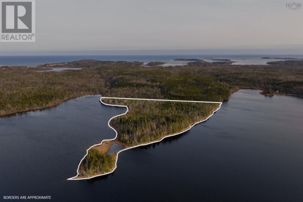 Drone view of a wooded peninsula on the lake, with property lines indicated by white outlines. - Long Pt Seaforth, Ns, Seaforth