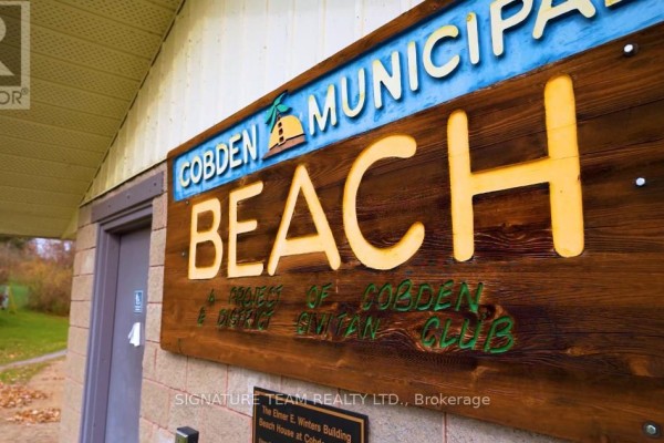 Close-up of the Cobden Municipal Beach sign on the facility. - Lot 1 Bonnechere Street, Whitewater Region