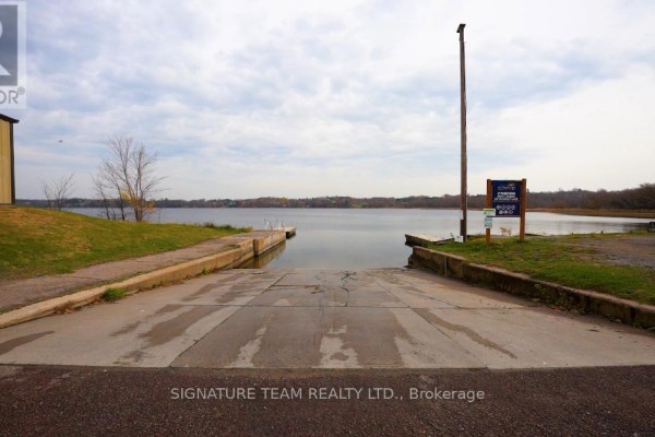 Boat launch area with concrete ramp leading to the water. - Lot 1 Bonnechere Street, Whitewater Region