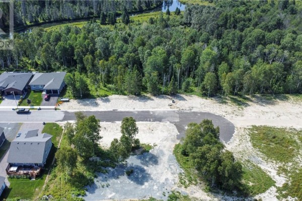 Aerial shot of residential lots, some cleared, some with trees, adjacent to existing houses and a wooded area. - Lot 1 Herman Mayer Drive, Lively