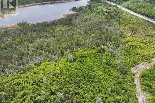 Wide aerial view of Spanish Ship Bay with homes, greenery, and a winding coastline. - Lot 1 Mackinley Point Road, Spanish Ship Bay