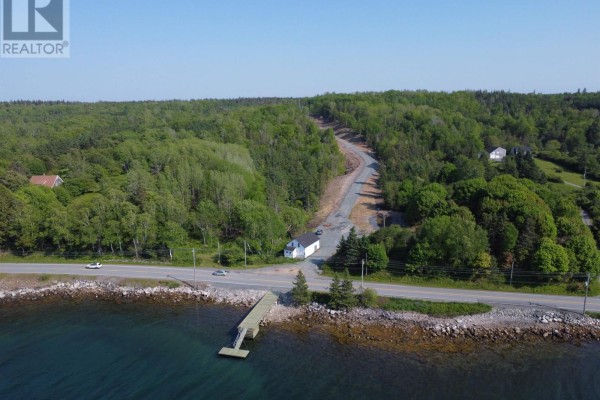 Aerial view of Lot 100 at 100 Peggys Cove Road, French Village, showing property lines, deeded wharf access, and water. - Lot 100 Peggys Cove Road, French Village