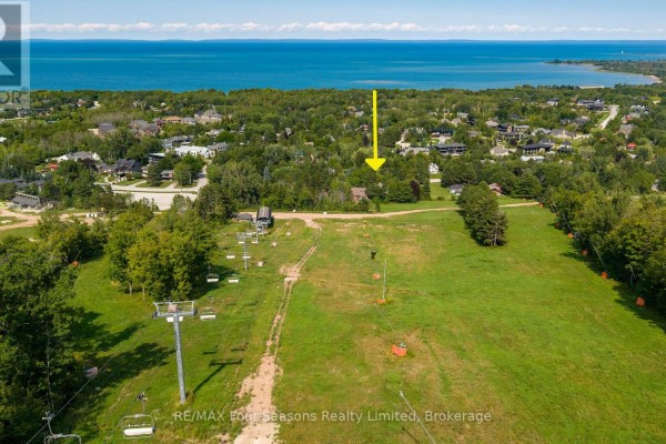 Aerial view showing the lot from a distance, with ski slopes and a large body of water. - Lot 11 Craigleith Road, Blue Mountains