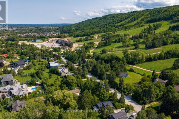 Panoramic aerial view of a Blue Mountains neighborhood with houses, ski slopes, and a lake. - Lot 11 Craigleith Road, Blue Mountains