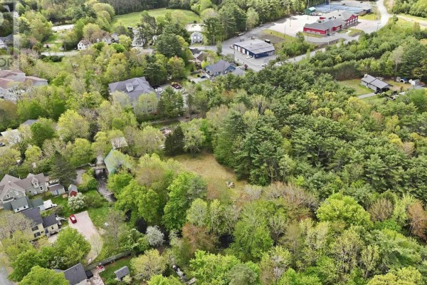 Aerial view of colorful buildings along a waterfront street with docked boats. - Lot 11 Kinburn Street, Mahone Bay