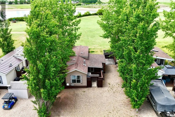 View from the property towards a large body of water and trees. - Lot 13  Hitchcock Hideaway, Lake Diefenbaker
