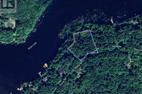 Aerial view showing lot boundaries of Lot 18 with Bass Lake on the left and Thomas Road. - Lot 18 - 1037 Thomas Road, Gravenhurst