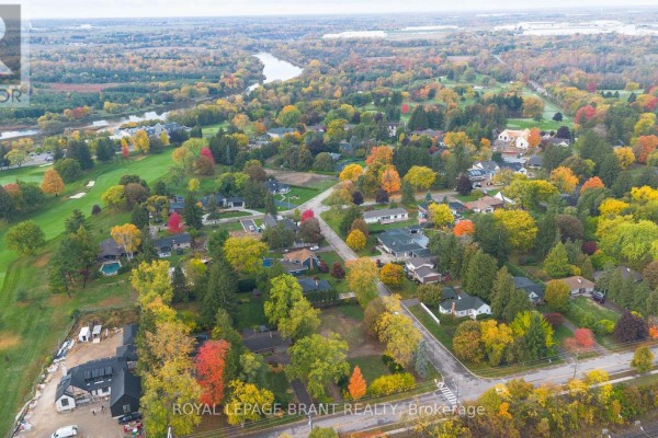 Aerial view of neighborhood with fall foliage, river in distance, and golf course. - Lot #2 - 72 Ava Road, Brantford