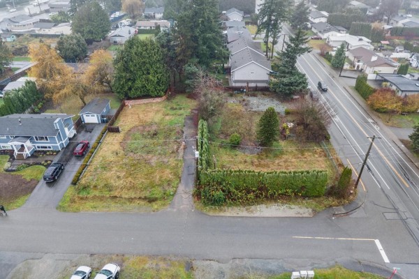 Aerial view of property divided into four lots, with red outlines on land and a street view. - Lot 2 26744 32 Avenue, Langley