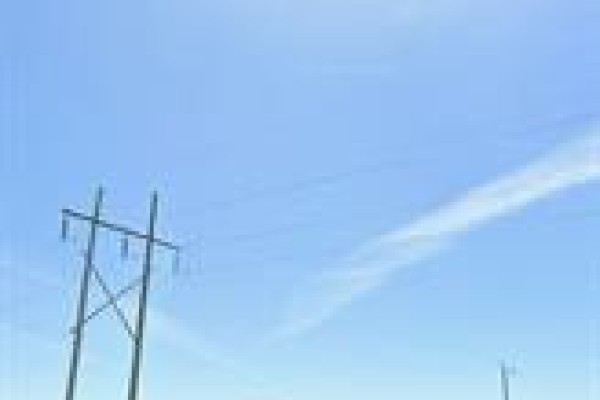 Tall wooden electricity pole with wires against a bright blue sky. - Lot 2 Winfield Road, Rockwood Rm