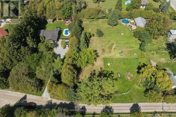 Aerial view of a residential area with houses, trees, and green lawns. - Lot 21 Part 1 Polva Promenade, Georgina