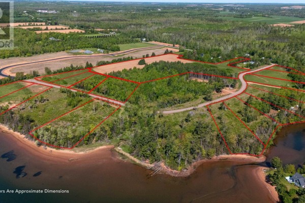 Aerial view of waterfront lots outlined in red near wooded areas and water. - Lot 22-16 White Pine Lane, Brudenell