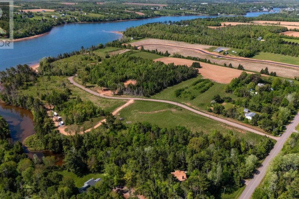 Aerial view of coastal property with water, trees, fields and roads. - Lot 22-16 White Pine Lane, Brudenell