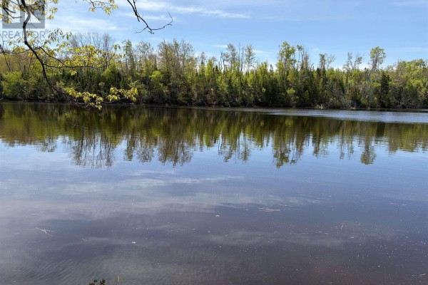 Wide view of a tranquil river with reflections of trees and sky. - Lot 23-3 155 Wallace Bridge Station Road, Wallace River West