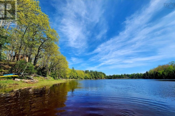 Scenic river view with trees lining the banks and a bright blue sky. - Lot 23-3 155 Wallace Bridge Station Road, Wallace River West