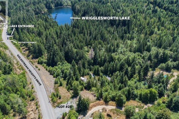 Aerial view showing Goldstream Heights Drive, Lot 23, and Wrigglesworth Lake surrounded by dense forest. - Lot 23 Goldstream Heights Dr, Shawnigan Lake