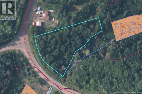 Aerial photograph displays a wooded property parcel outlined in turquoise, bordered by roads. - Lot 24-01 Route 560, Listerville