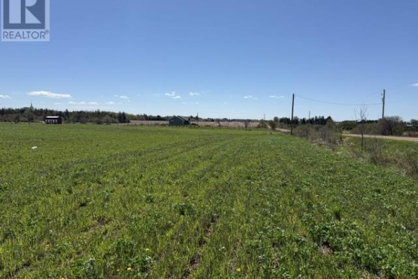 Panoramic view of fields with snow remnants and distant landscape under a sunny sky - Lot 4 Baseline Rd, Malpeque